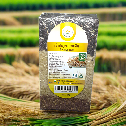 A package of 3 Kings Rice featuring a combination of Rice Berry, Brown Rice, and Khao Man Pou, displayed against a natural background with rice plants in the foreground.