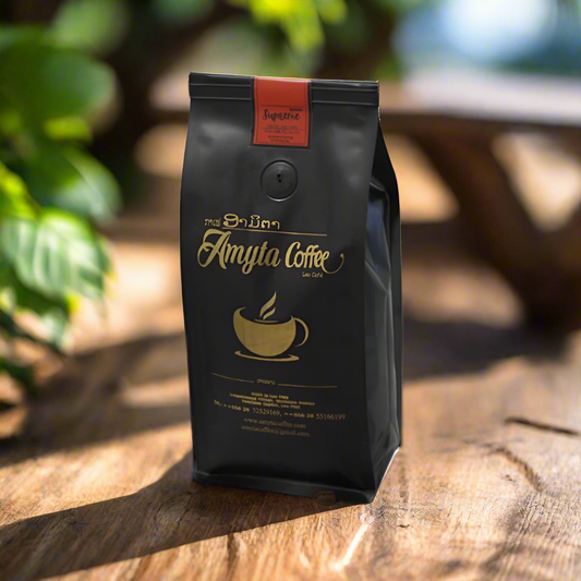 A package of Amyta Coffee Supreme Blend coffee beans, with a graphic of a coffee cup and beans, set against a natural background.