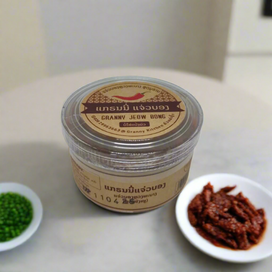 Granny Jeow Bong 100g – traditional Lao spicy chili paste in a clear pouch, made from authentic local ingredients, perfect as a souvenir or gift from Laos.