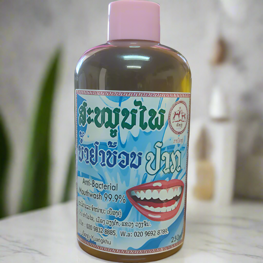 Product shot of a 250ml PET bottle of Lao Souvenir Herbal Anti-Bacterial Mouthwash on a white background. The label is primarily white and green, with text indicating it's an alcohol-free formula for fresh breath and oral health.