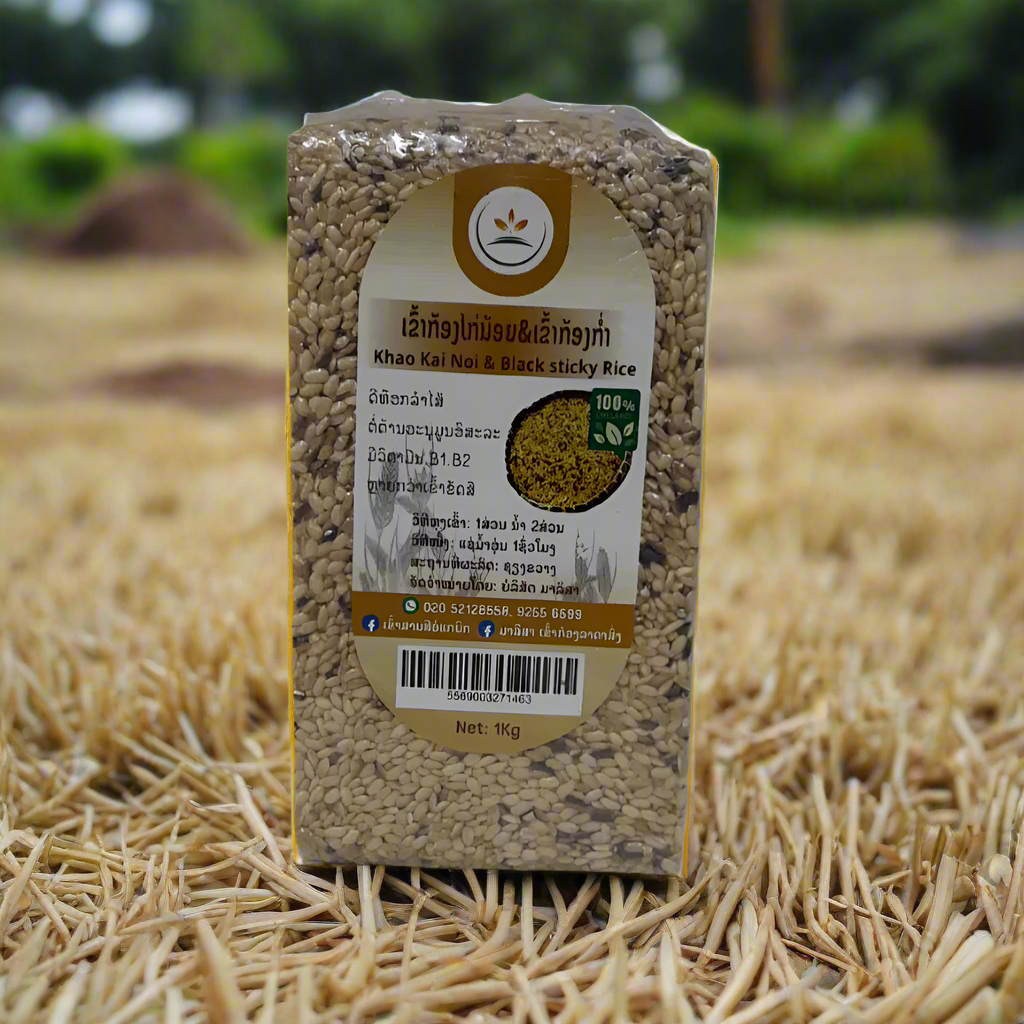 A vacuum-sealed package of Khao Kai Noi & Black Sticky Rice on a straw mat background.