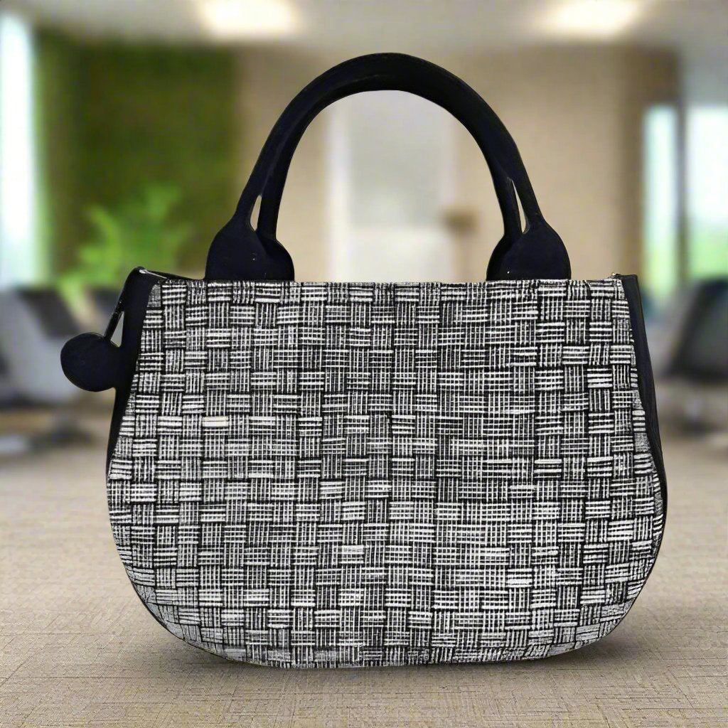 Elegant Black and White Woven Handbag with Pom-Pom Accent | Handmade in Laos