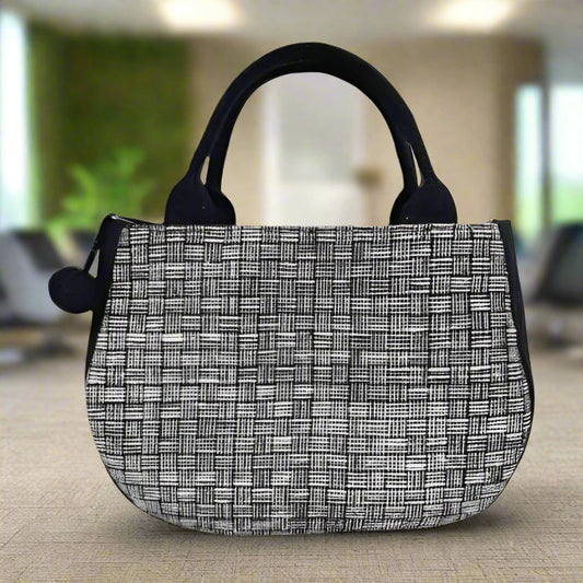 Elegant Black and White Woven Handbag with Pom-Pom Accent | Handmade in Laos