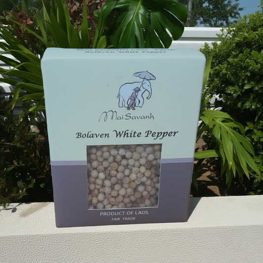 Mal Savanh Bolaven White Pepper packaging with an elephant illustration against a green leafy background