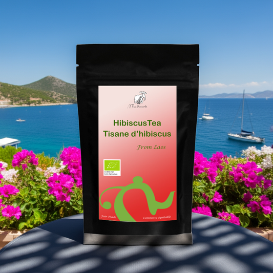 Hibiscus tea package with a scenic background of flowers and water.