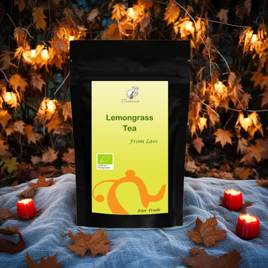Lemongrass tea package with a decorative background of candles and leaves