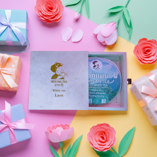 Tea packaging with decorative flowers and gift boxes on a colorful background